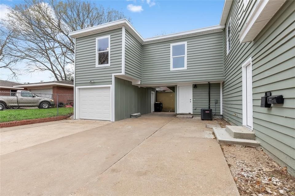 702 East Main Street Brenham, TX 77833 - Photo 2 of 7 a view of a house with a yard and potted plants