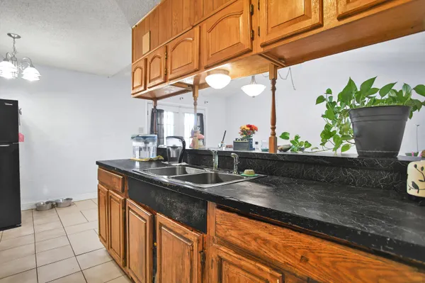 a kitchen with stainless steel appliances granite countertop a sink and a granite counter tops