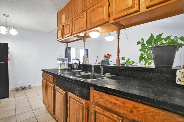 a kitchen with stainless steel appliances granite countertop a sink and a granite counter tops