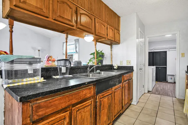 a kitchen with stainless steel appliances granite countertop a sink and cabinets