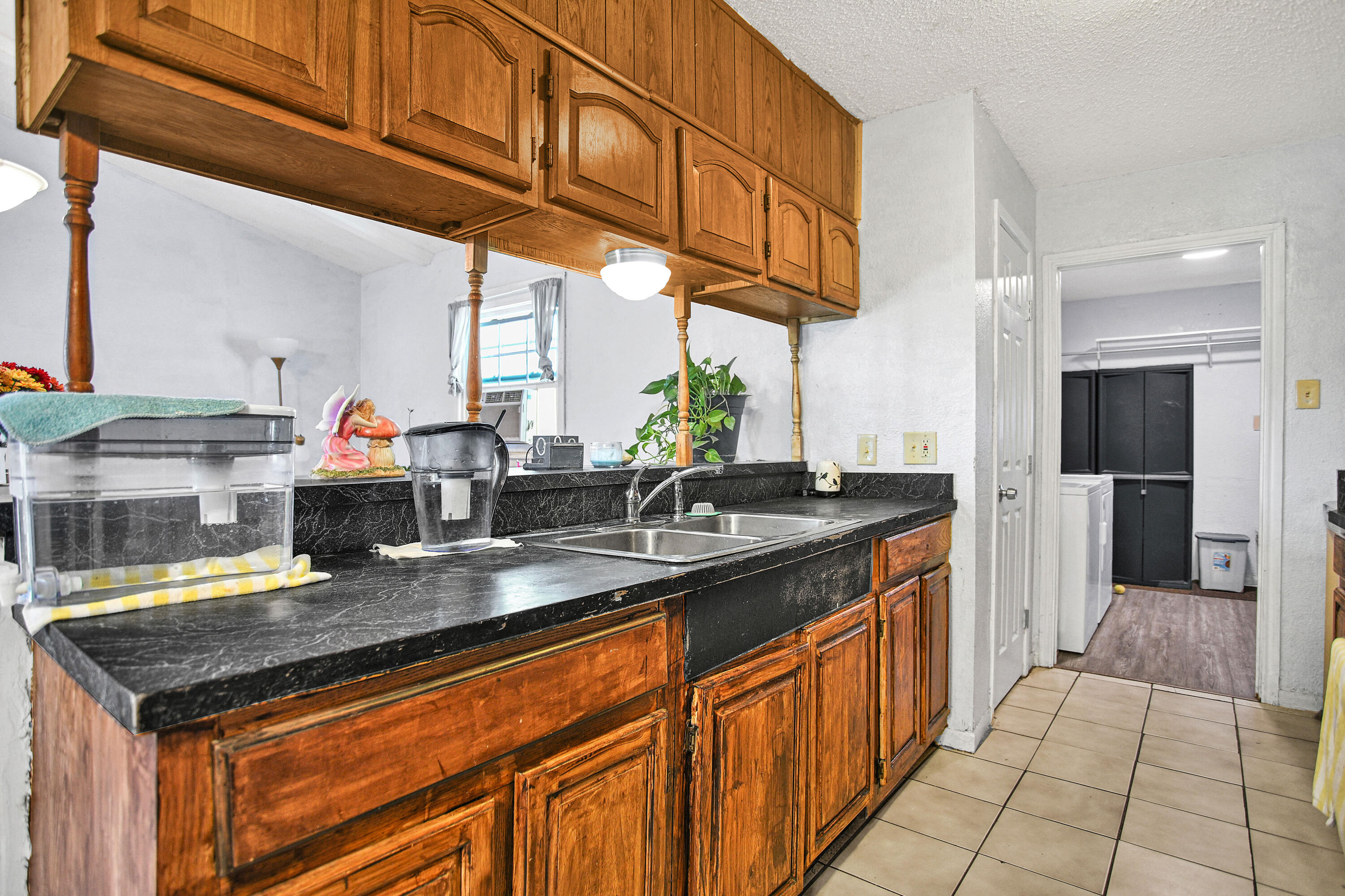 1810 East Colgate Street Lubbock, TX 79403 - Photo 15 of 40 a kitchen with stainless steel appliances granite countertop a sink and cabinets