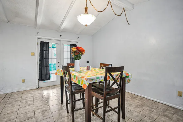 a dining room with furniture and window