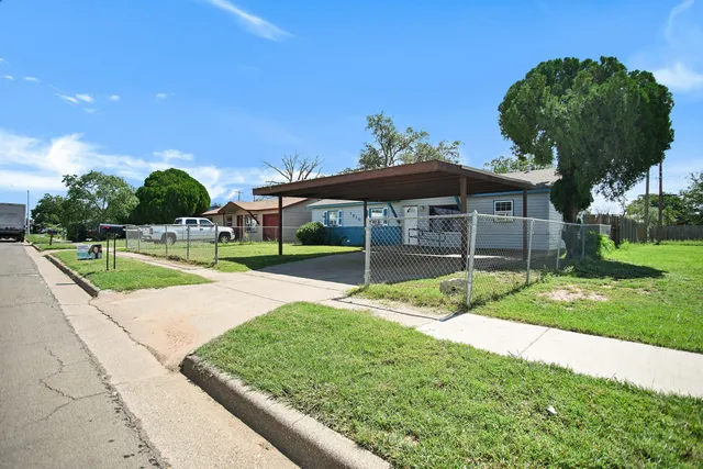 a view of a house with a big yard