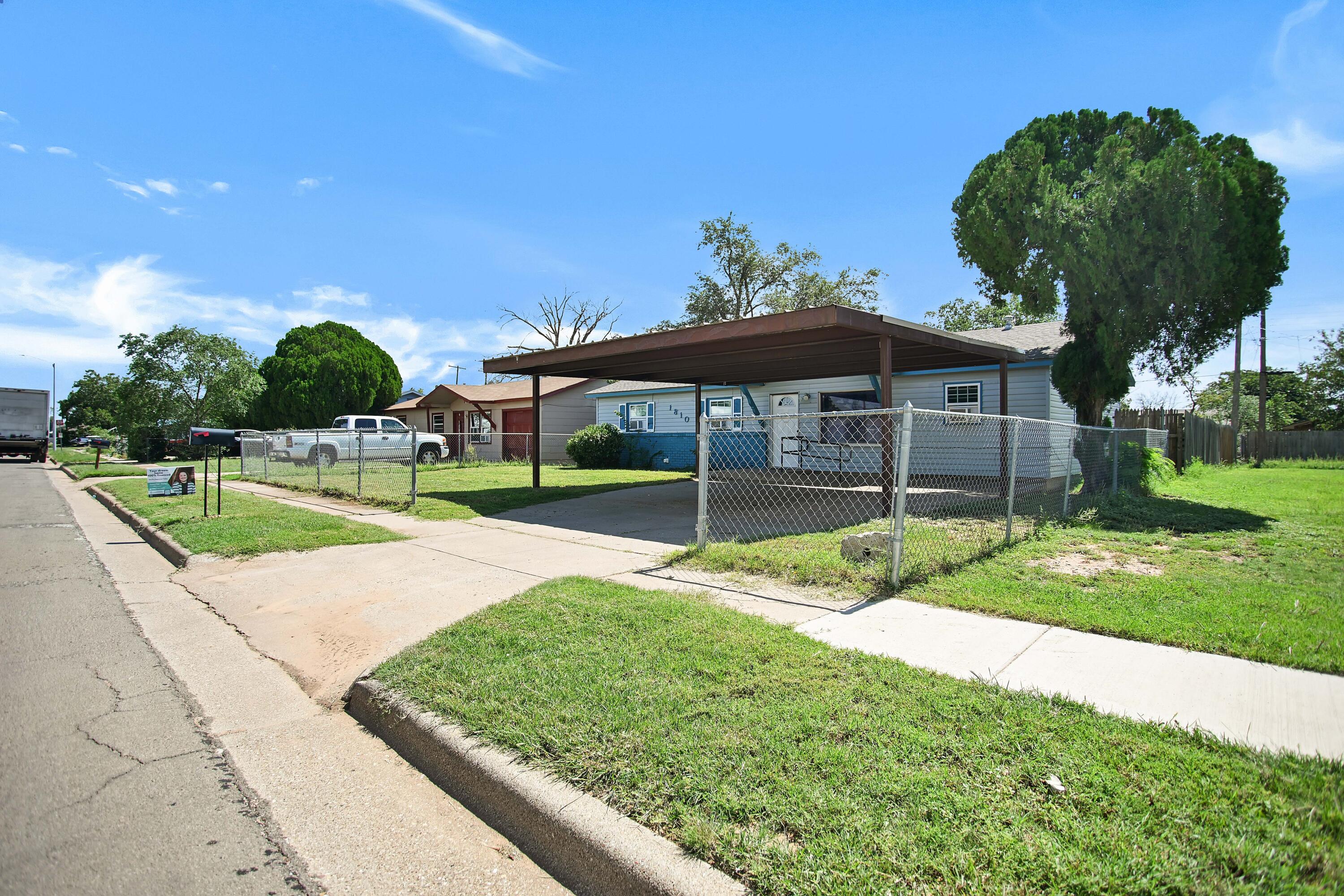 1810 East Colgate Street Lubbock, TX 79403 - Photo 2 of 40 a view of a house with a big yard