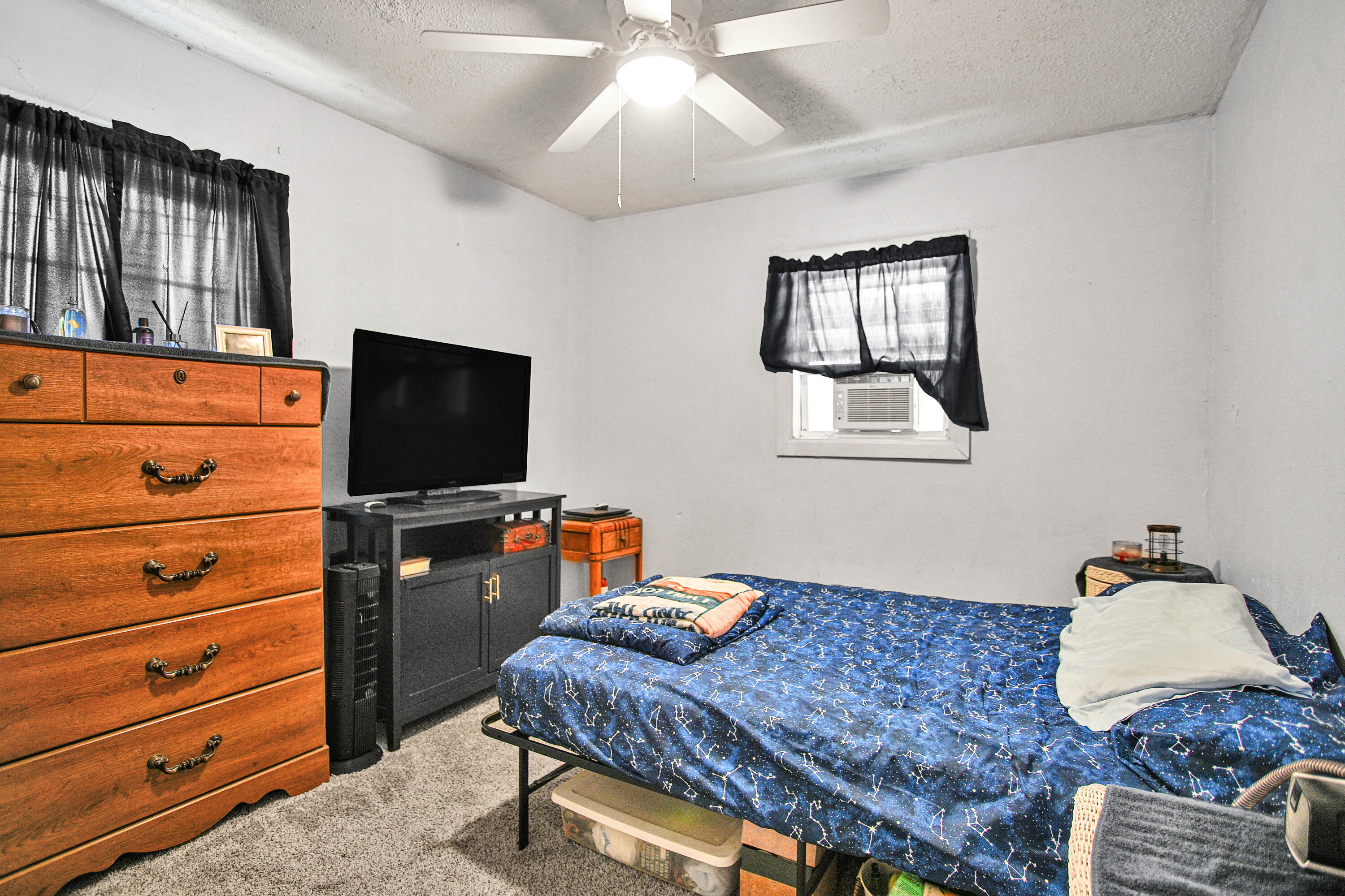 1810 East Colgate Street Lubbock, TX 79403 - Photo 23 of 40 a living room with furniture and a flat screen tv