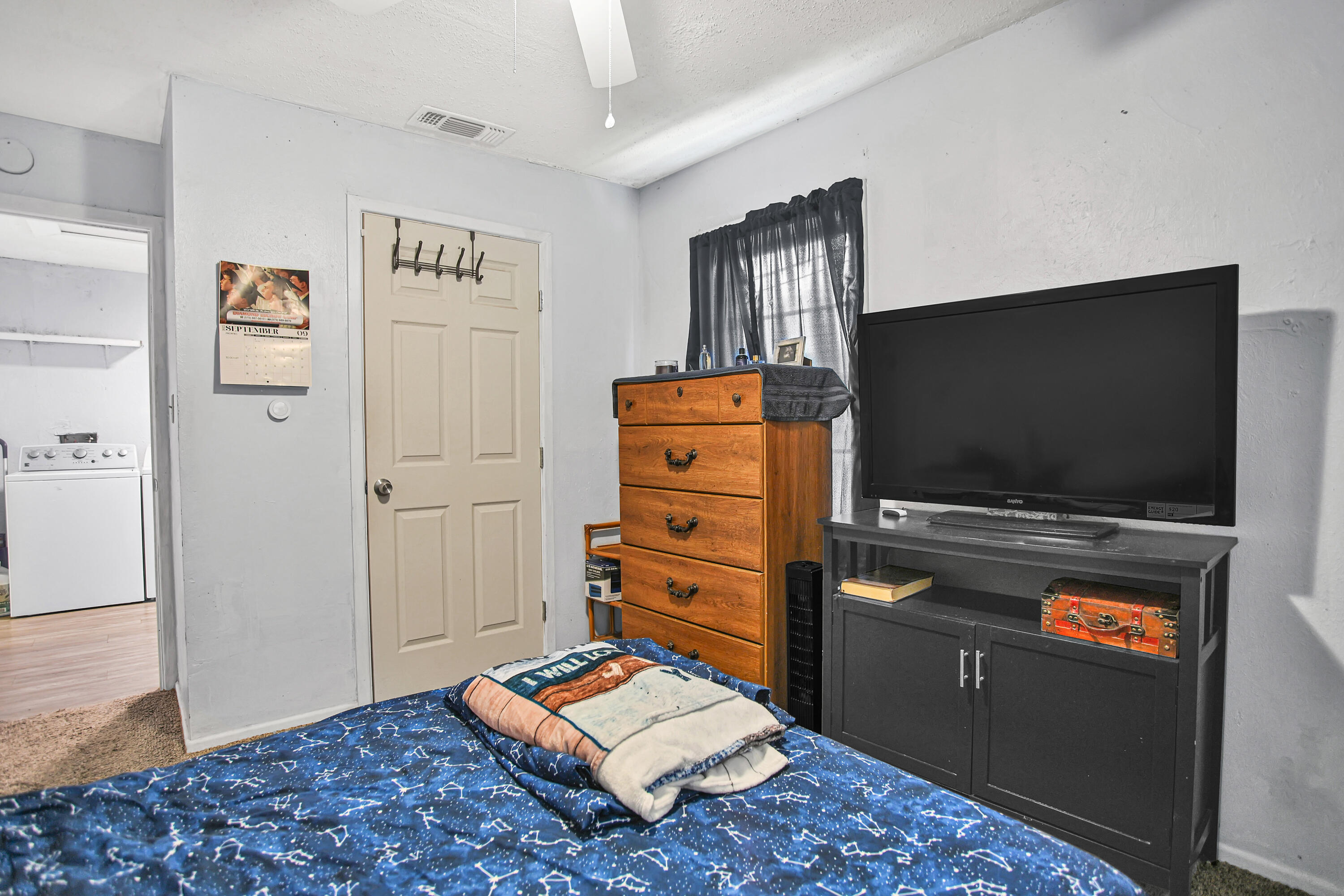 1810 East Colgate Street Lubbock, TX 79403 - Photo 26 of 40 a living room with furniture and a flat screen tv