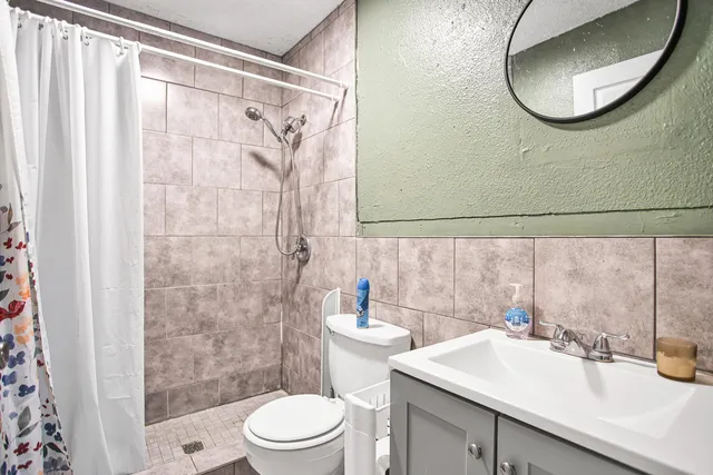 a bedroom with a bed and cabinets