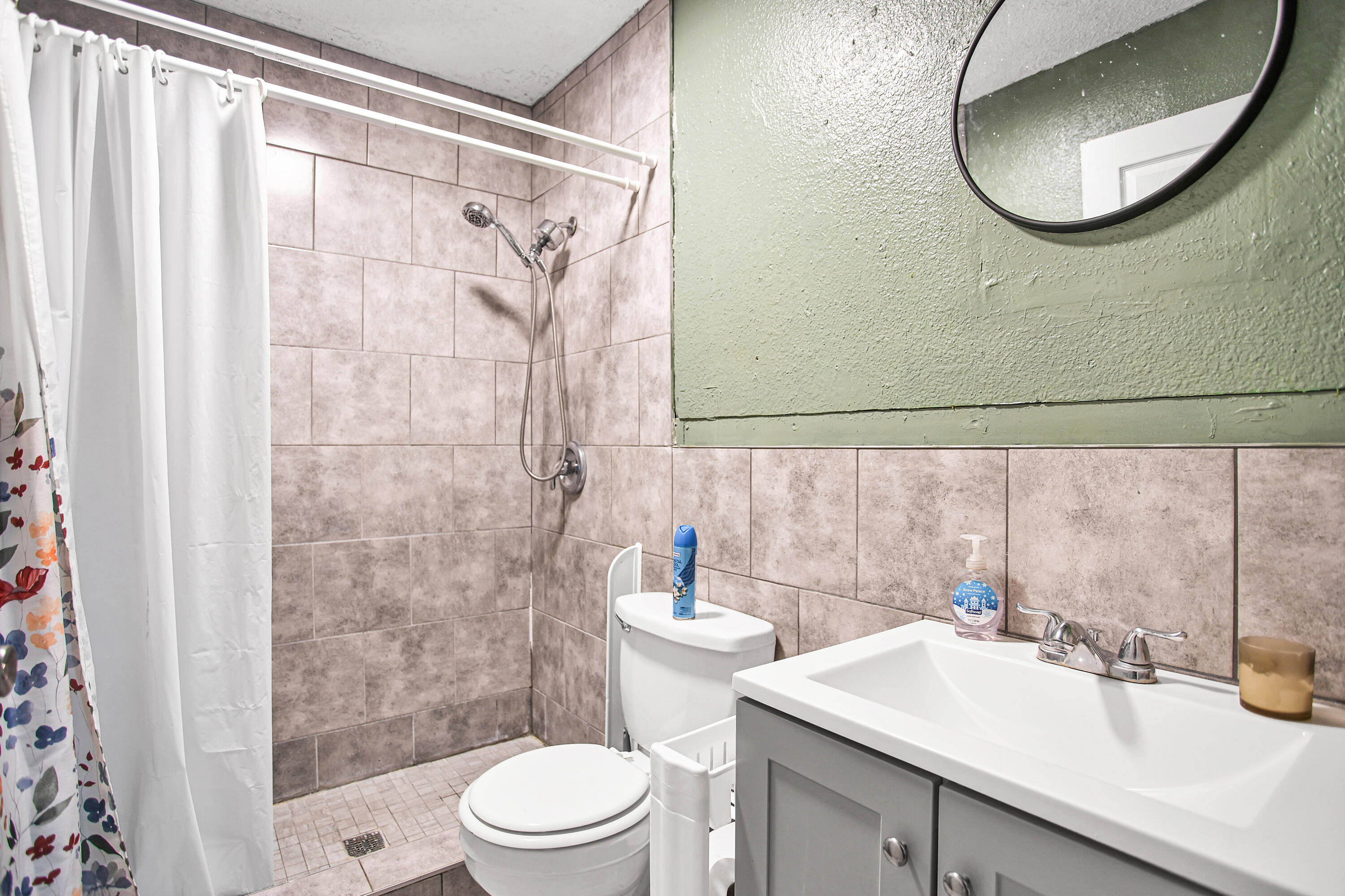 1810 East Colgate Street Lubbock, TX 79403 - Photo 29 of 40 a bathroom with a sink a toilet and shower