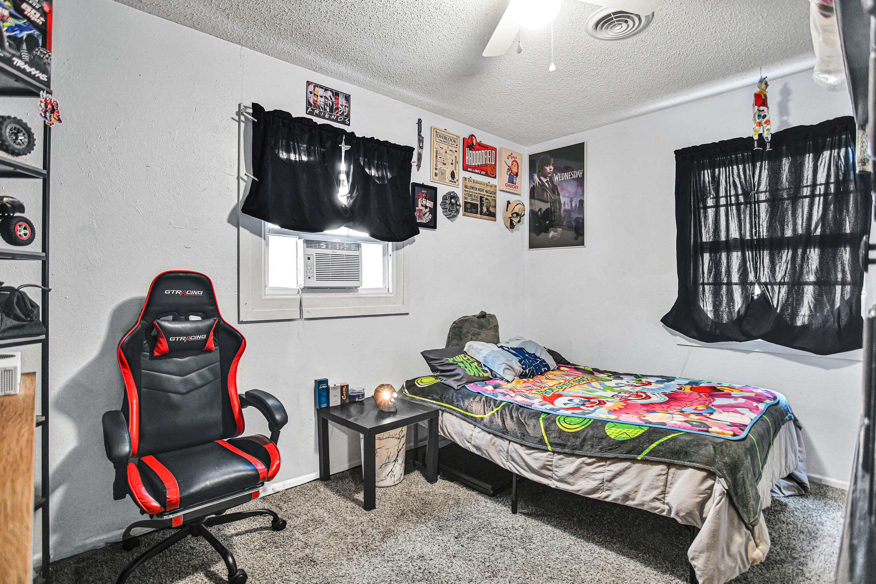 1810 East Colgate Street Lubbock, TX 79403 - Photo 30 of 40 a bedroom with a bed and cabinets