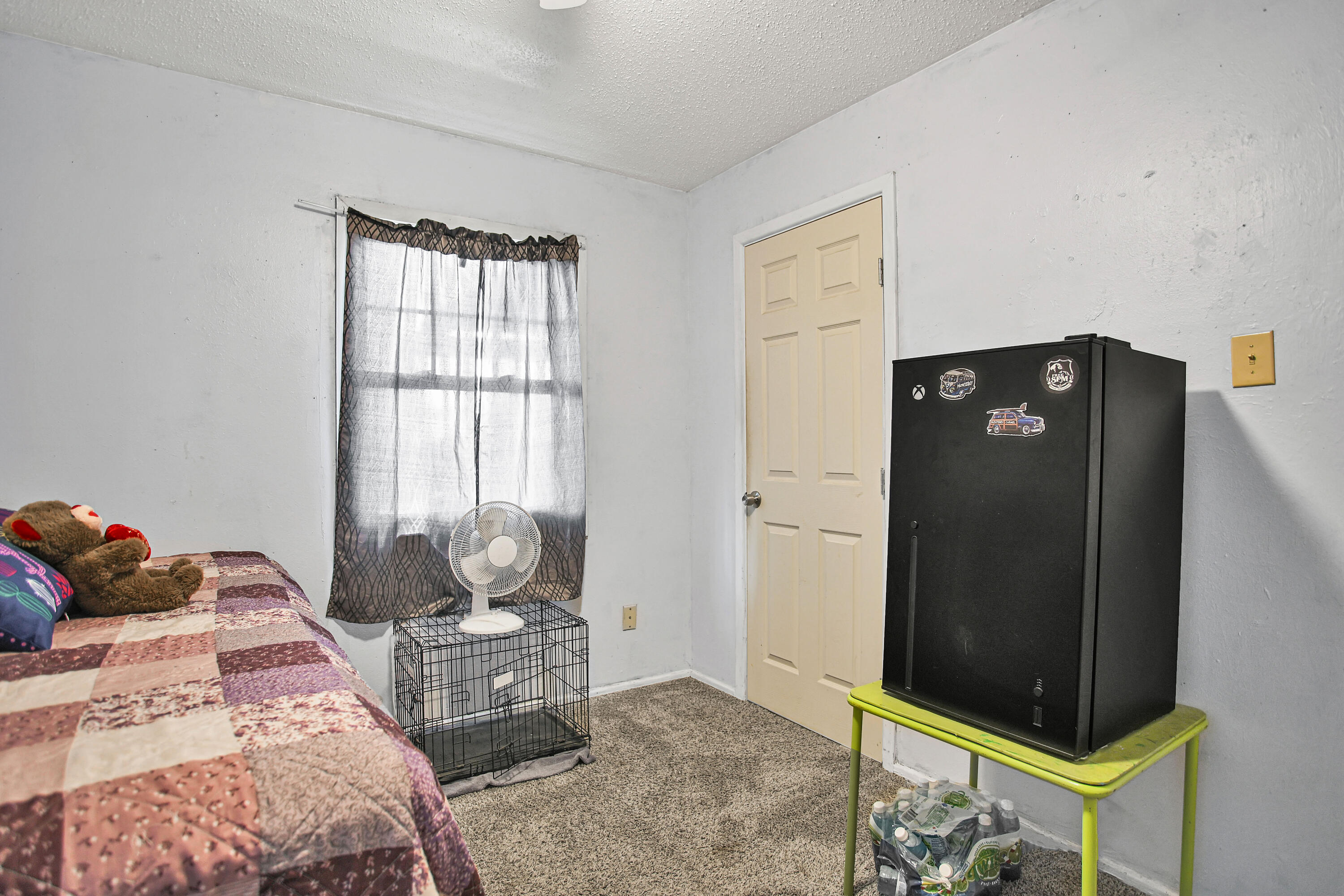 1810 East Colgate Street Lubbock, TX 79403 - Photo 33 of 40 a bedroom with a bed and wooden floor