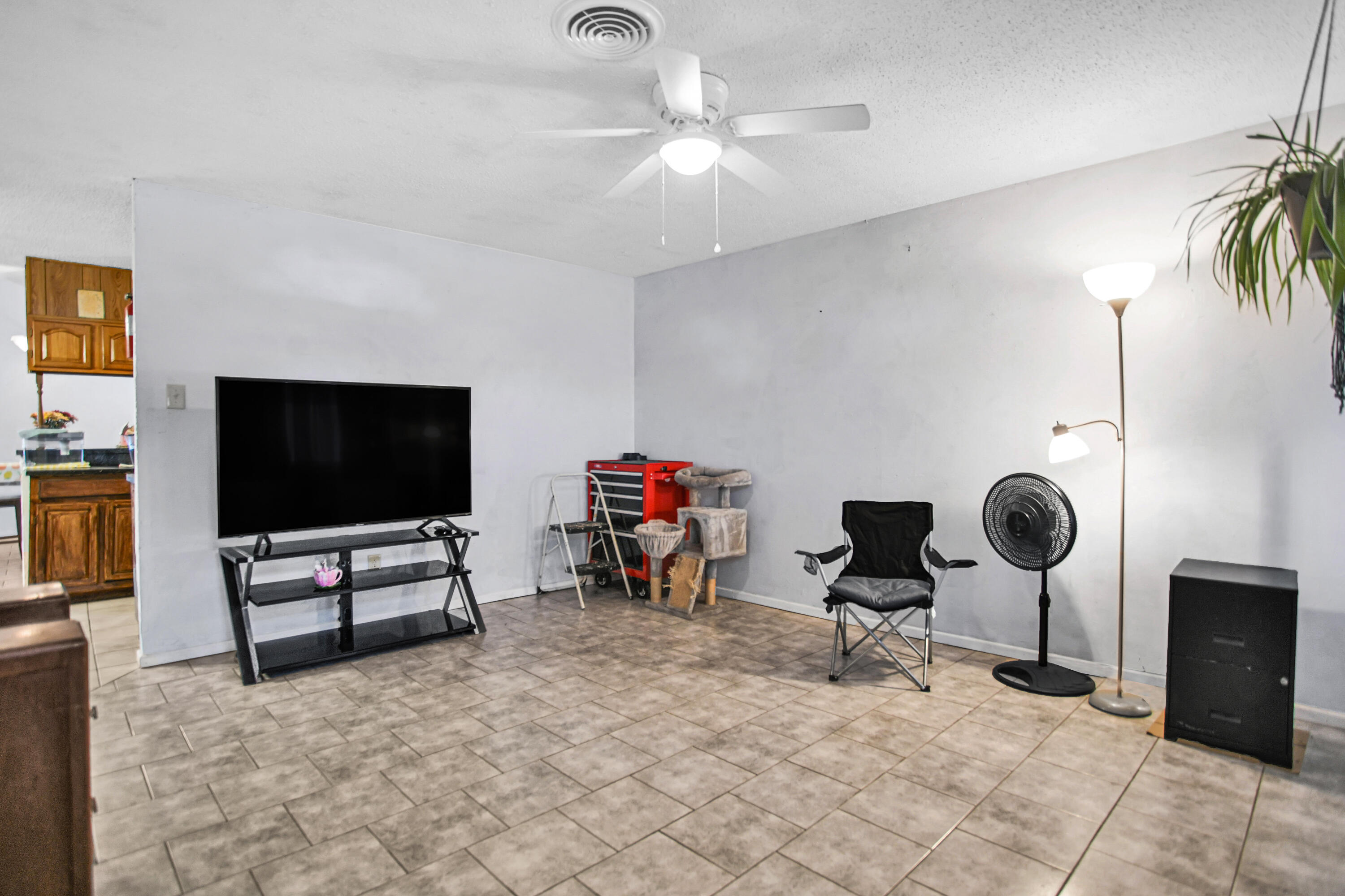 1810 East Colgate Street Lubbock, TX 79403 - Photo 4 of 40 a living room with furniture and a flat screen tv