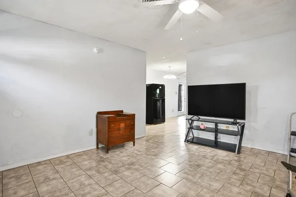 a living room with couch and a flat screen tv
