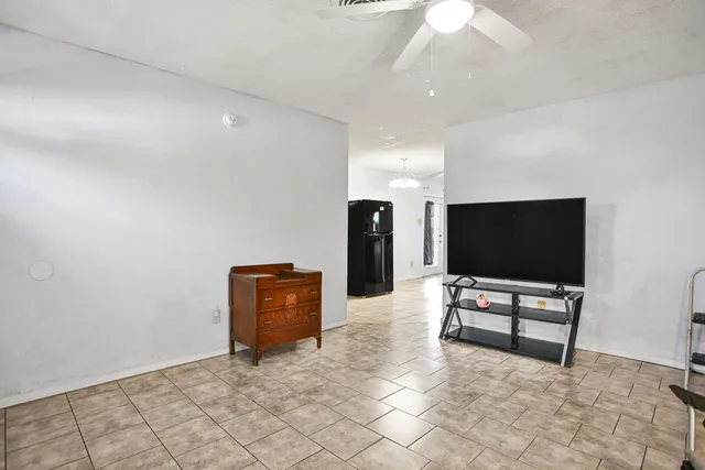 a living room with couch and a flat screen tv