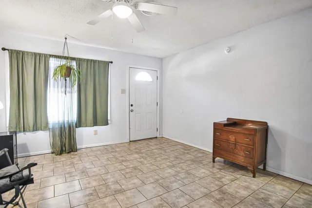 a room that has a bed and a chair in it