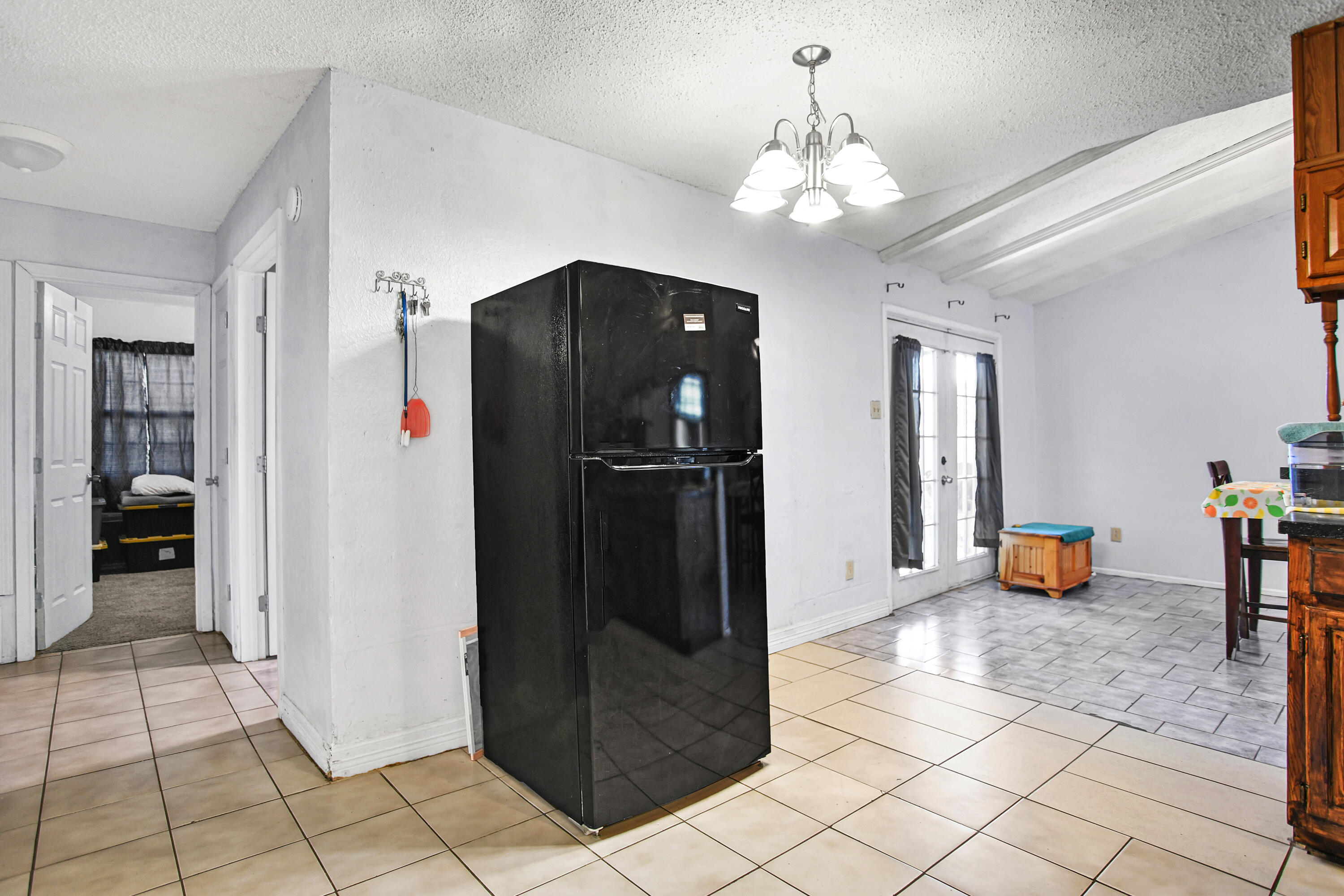 1810 East Colgate Street Lubbock, TX 79403 - Photo 10 of 40 a view of a hallway with dining area and chandelier