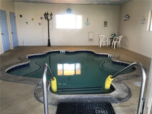 a room with gym equipment and view of living room
