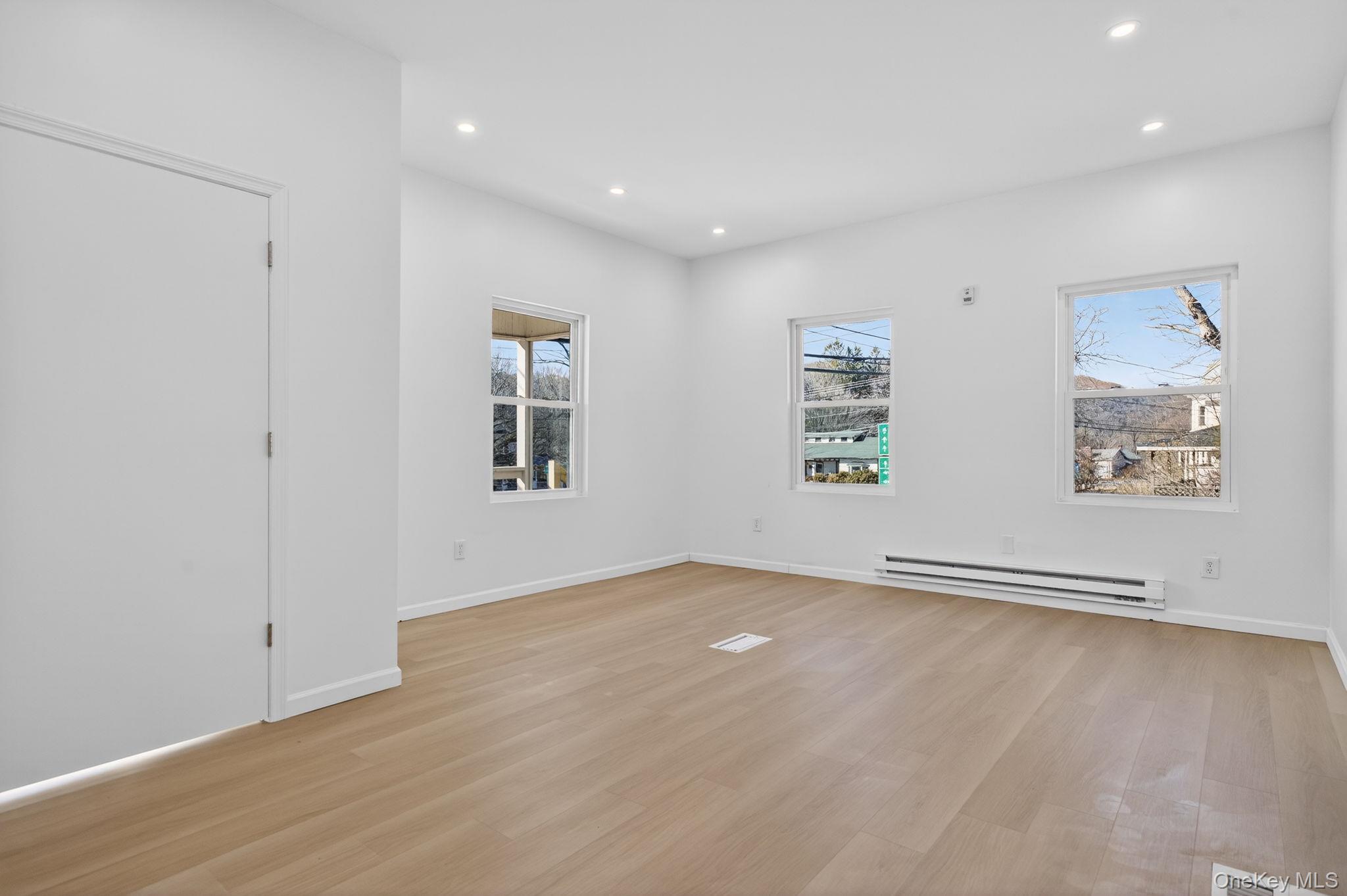 2016 Old Rte 17, Unit 1 Roscoe, NY 12776 - Photo 2 of 18 Living room with large windows