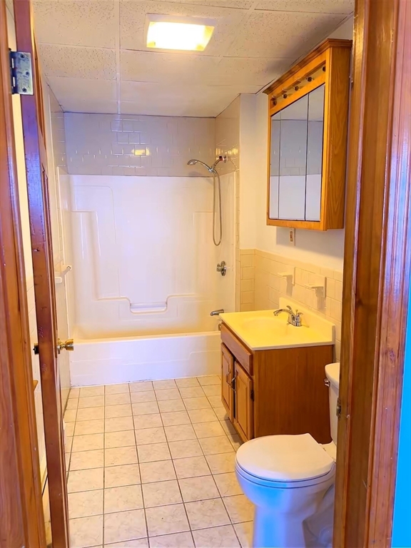 29 Hancock Street, Unit 2 Brockton, MA 02301 - Photo 6 of 6 a bathroom with a sink a toilet a mirror and shower