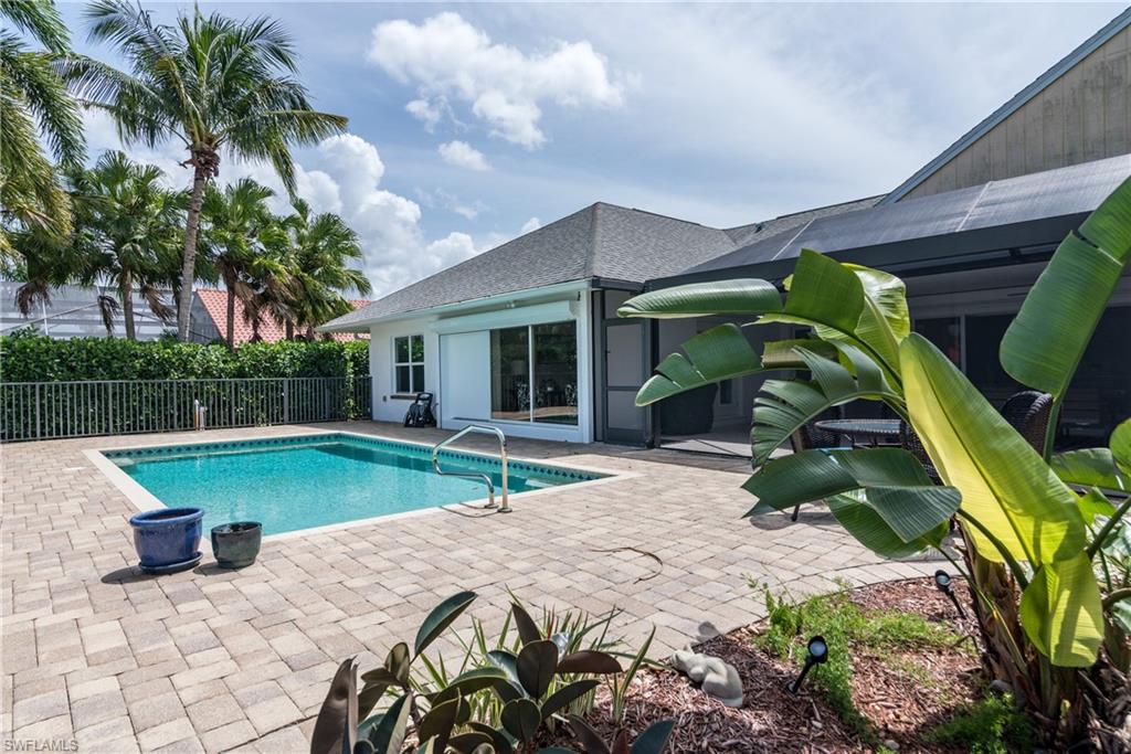 2500 Kings Lake Boulevard Naples, FL 34112 - Photo 26 of 31 a view of a house with backyard and sitting area