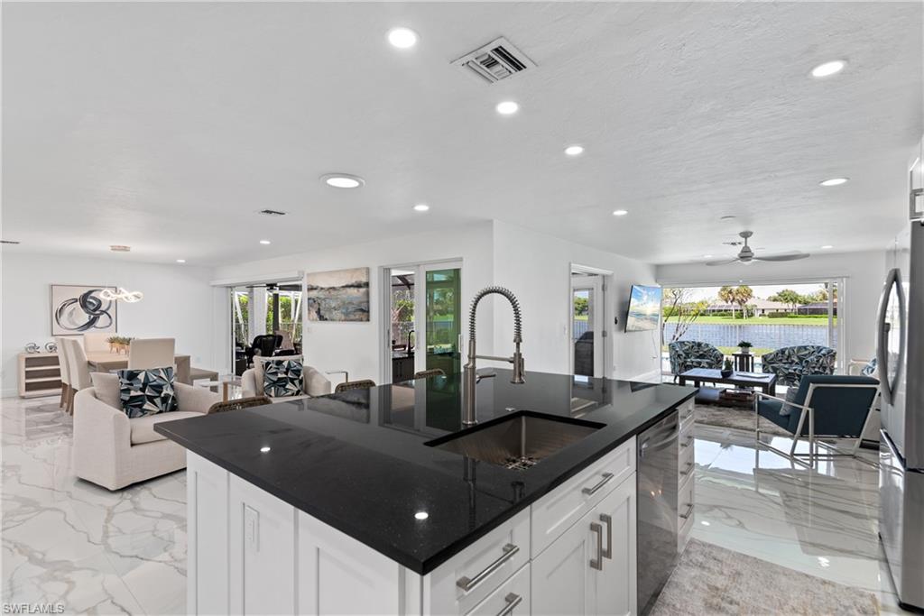 2500 Kings Lake Boulevard Naples, FL 34112 - Photo 9 of 31 a kitchen with lots of counter top space