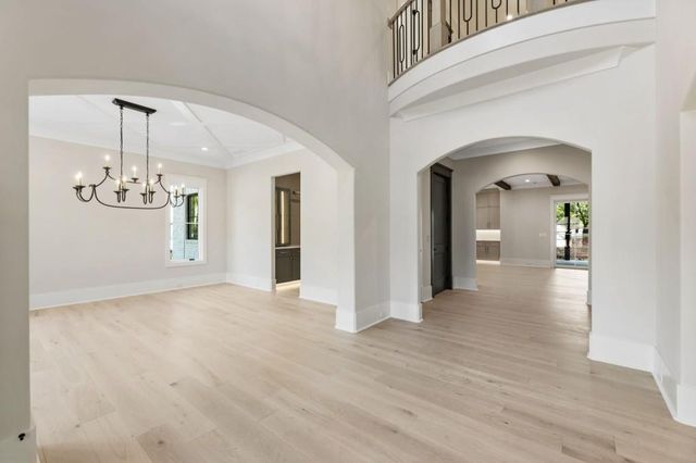 a spacious bathroom with a granite countertop sink mirror and bathtub