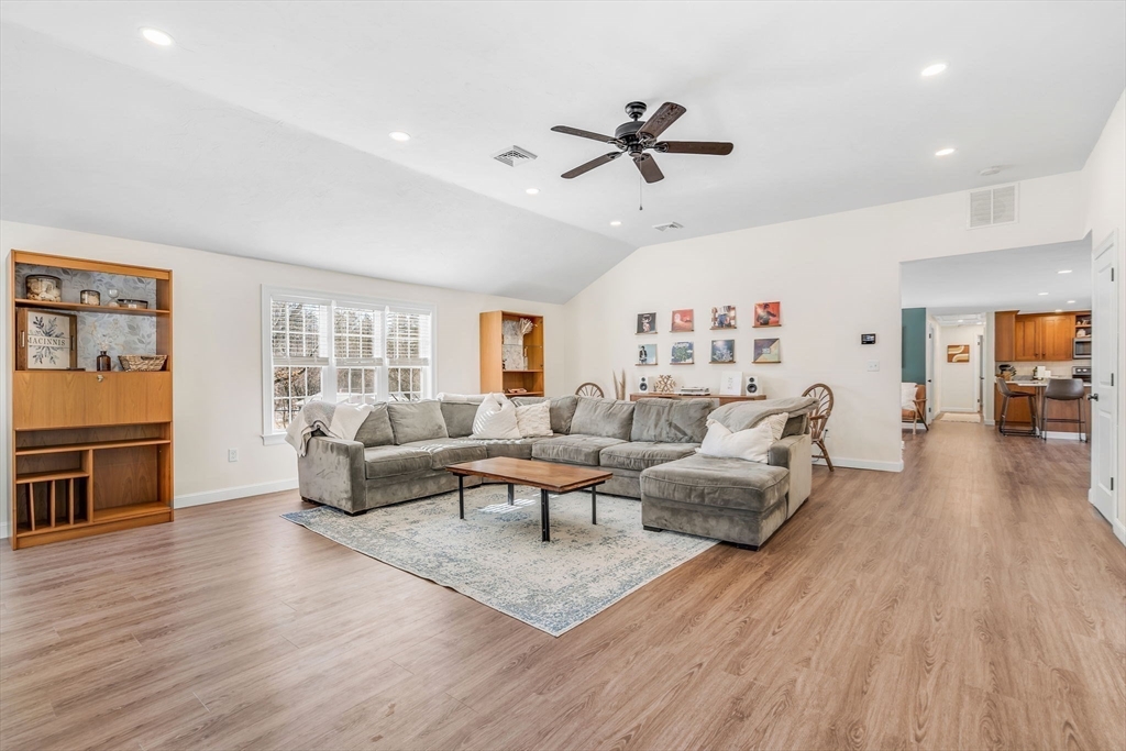 137 Harvard Road Stow, MA 01775 - Photo 6 of 18 a living room with furniture and a wooden floor