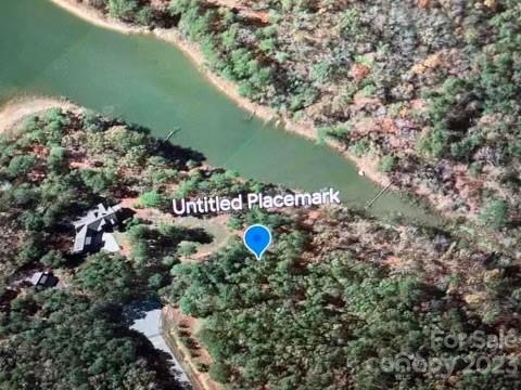 58 North State Lane, Unit 58 Rockingham, NC 28379 - Photo 1 of 5 a view of a lake with a yard