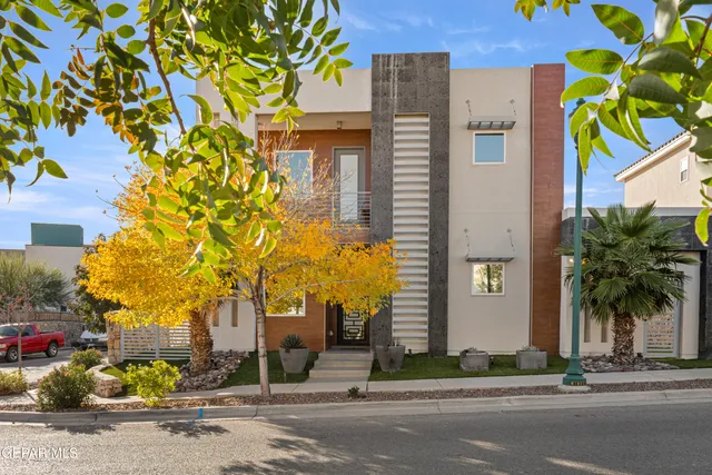 a kitchen with stainless steel appliances a sink a stove and cabinets
