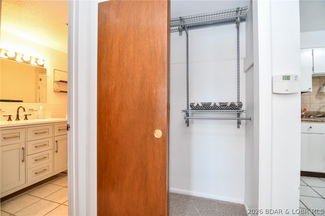 1118 Passover Road, Unit E216 Osage Beach, MO 65065 - Photo 16 of 31 Closet off of kitchen/bathroom