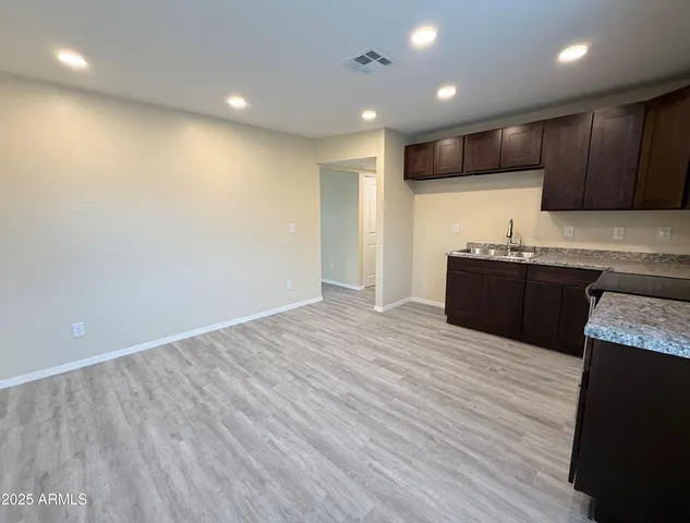 a view of kitchen with wooden floor