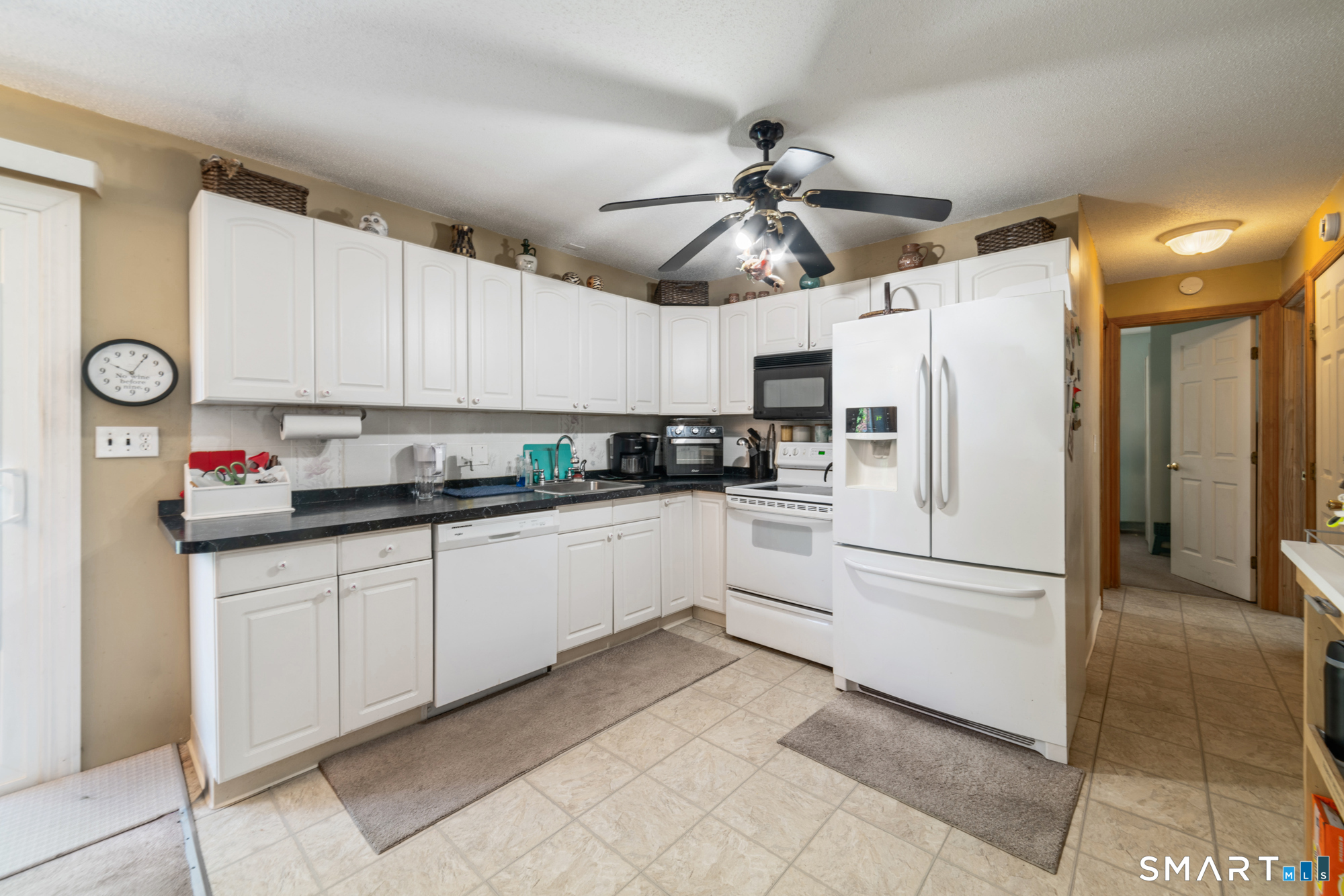 146 Highland Drive Waterbury, CT 06708 - Photo 6 of 31 a kitchen with stainless steel appliances granite countertop a refrigerator sink and cabinets