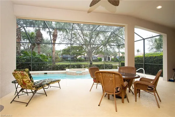a view of a dining room with furniture and window