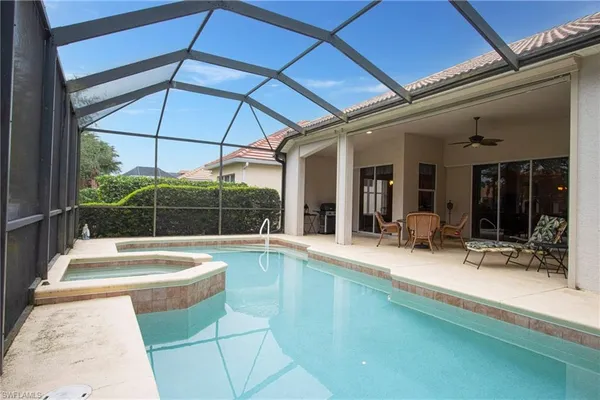 a view of a swimming pool with a patio