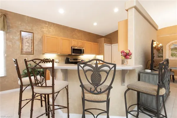 a kitchen with a sink cabinets and window