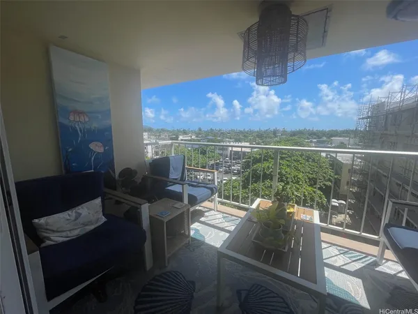 a view of balcony with furniture