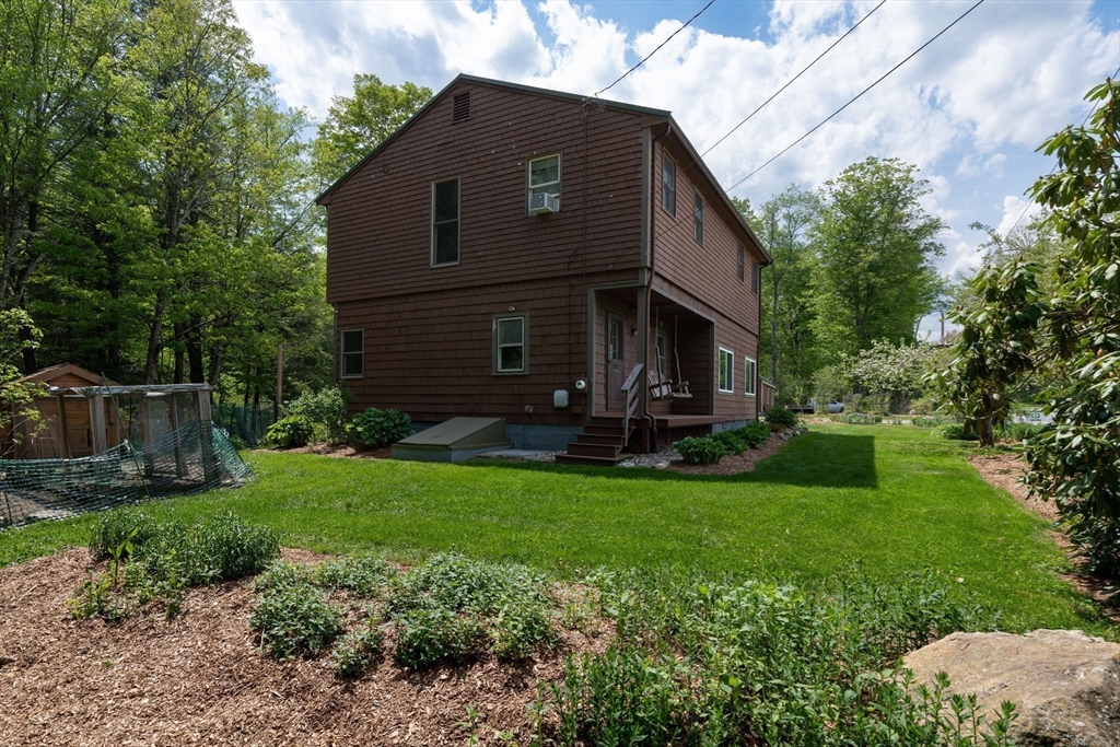 425 Dingle Road Worthington, MA 01098 - Photo 22 of 32 a view of a house with backyard and garden