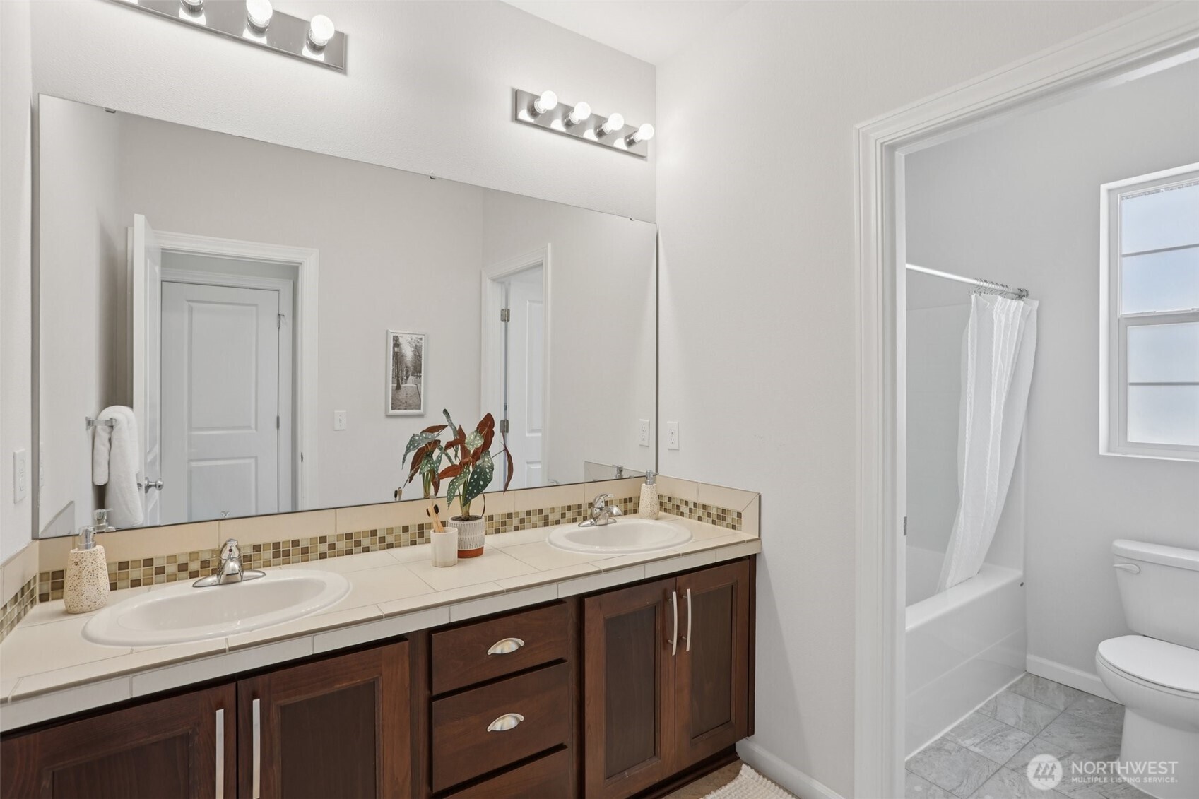 19817 35th Drive Southeast Bothell, WA 98012 - Photo 12 of 34 a bathroom with a sink and a mirror