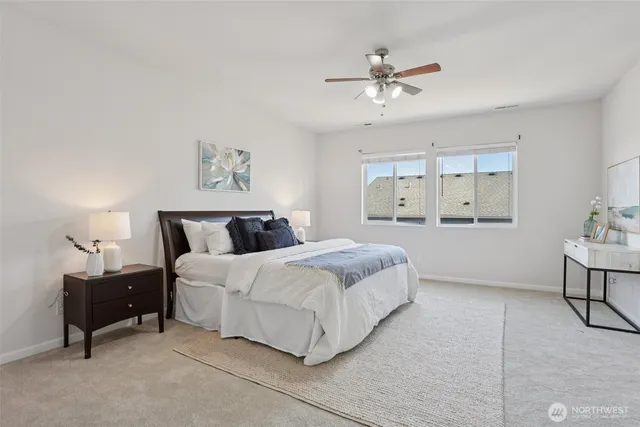 a spacious bedroom with a bed and a table