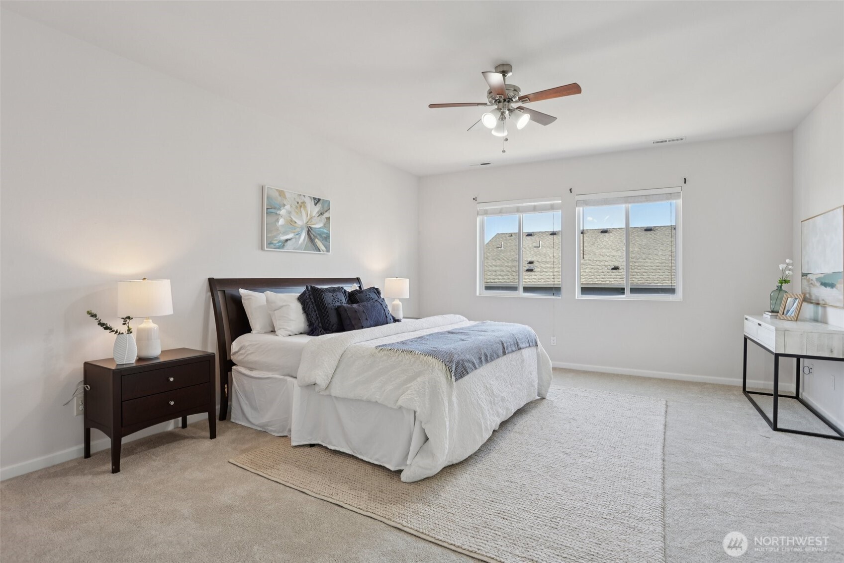 19817 35th Drive Southeast Bothell, WA 98012 - Photo 20 of 34 a spacious bedroom with a bed and a table