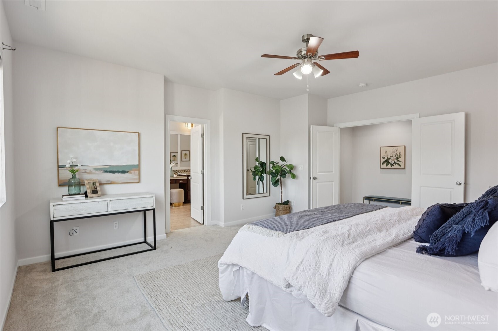 19817 35th Drive Southeast Bothell, WA 98012 - Photo 22 of 34 a bedroom with a large bed and a chandelier