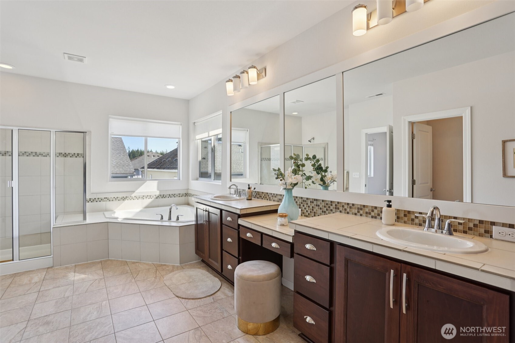 19817 35th Drive Southeast Bothell, WA 98012 - Photo 23 of 34 a spacious bathroom with a granite countertop double sink and a mirror