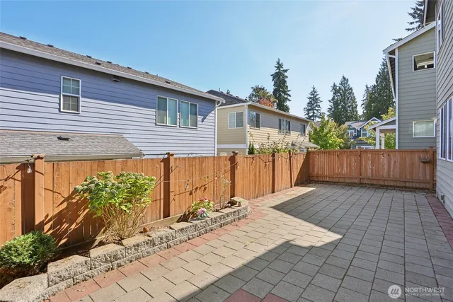 a view of a backyard with sitting area