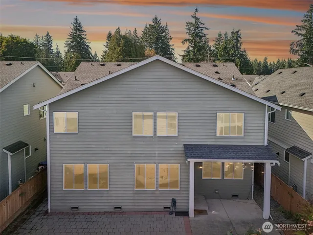 a view of a house with a yard and garage