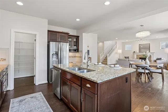 a kitchen with a counter top space appliances and cabinets