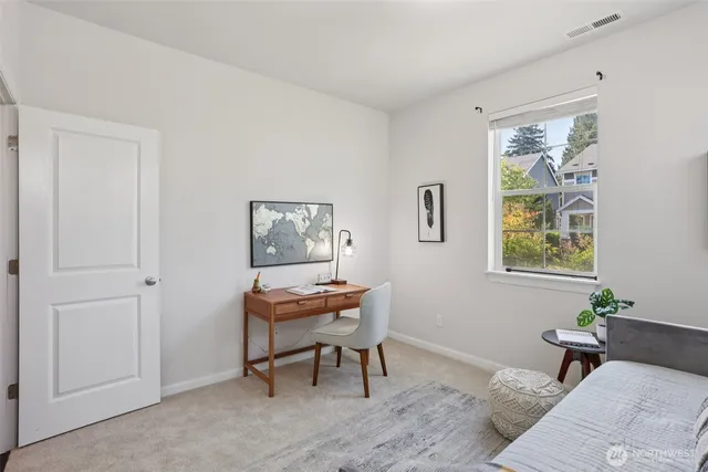 a workspace with furniture and window