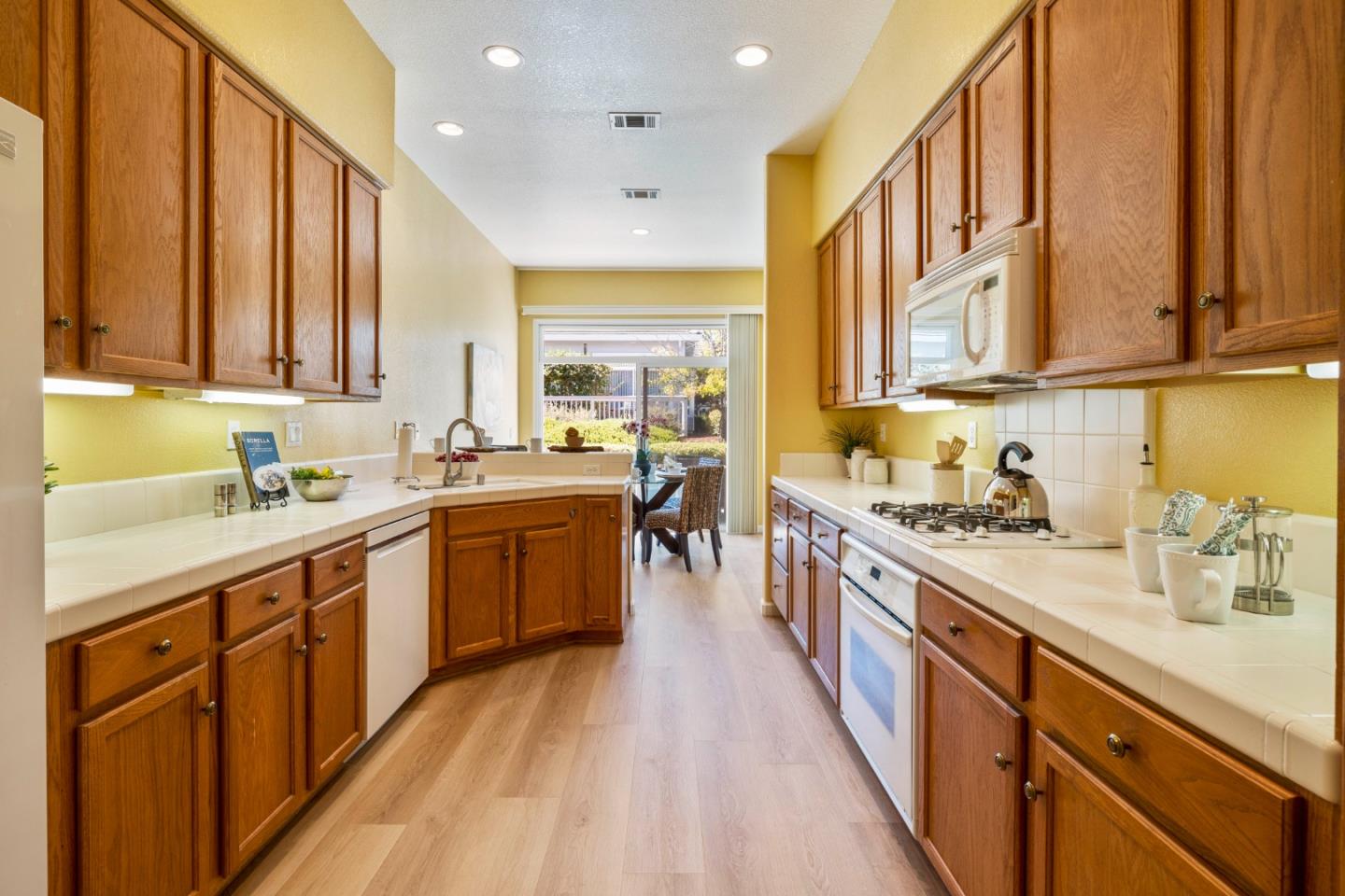 2016 Carignan Way San Jose, CA 95135 - Photo 11 of 44 a kitchen with stainless steel appliances sink stove top oven and cabinets