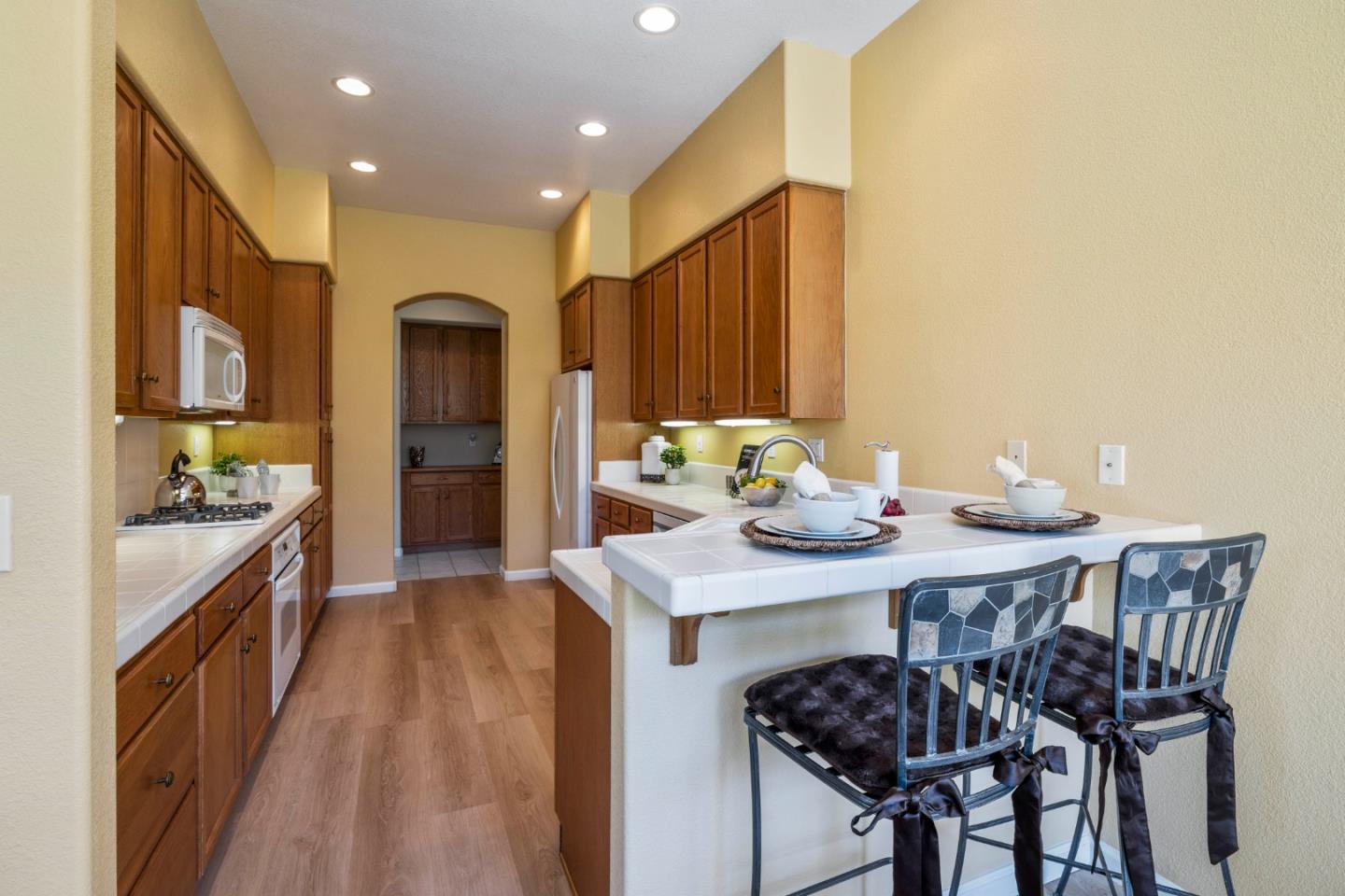 2016 Carignan Way San Jose, CA 95135 - Photo 12 of 44 a view of a dining room with furniture and wooden floor