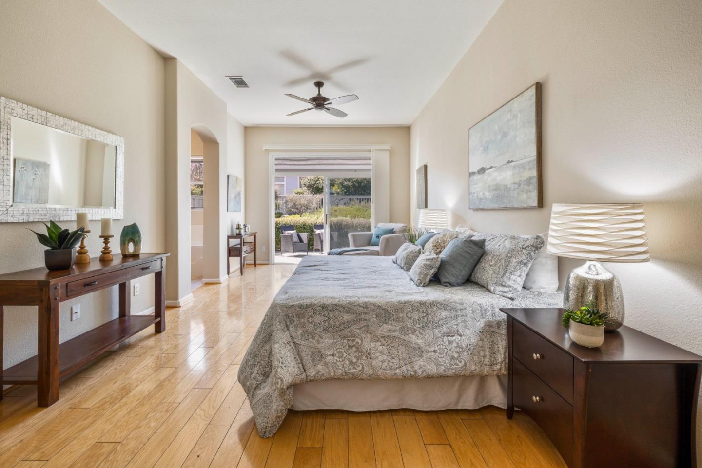 2016 Carignan Way San Jose, CA 95135 - Photo 14 of 44 a spacious bedroom with a bed and wooden floor