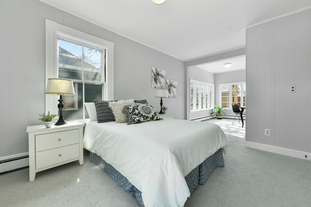 a bedroom with bed and window