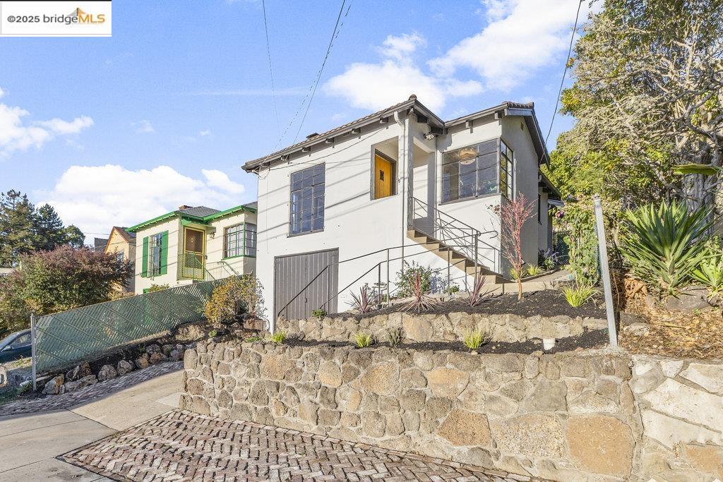 85 Stratford Road Kensington, CA 94707 - Photo 1 of 1 View of home's exterior with stucco siding and stairs